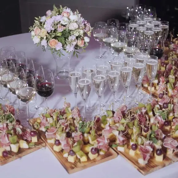 A catered buffet by Dnister with canapes and glasses
