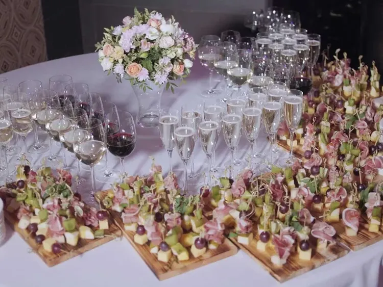 A catered buffet by Dnister with canapes and glasses