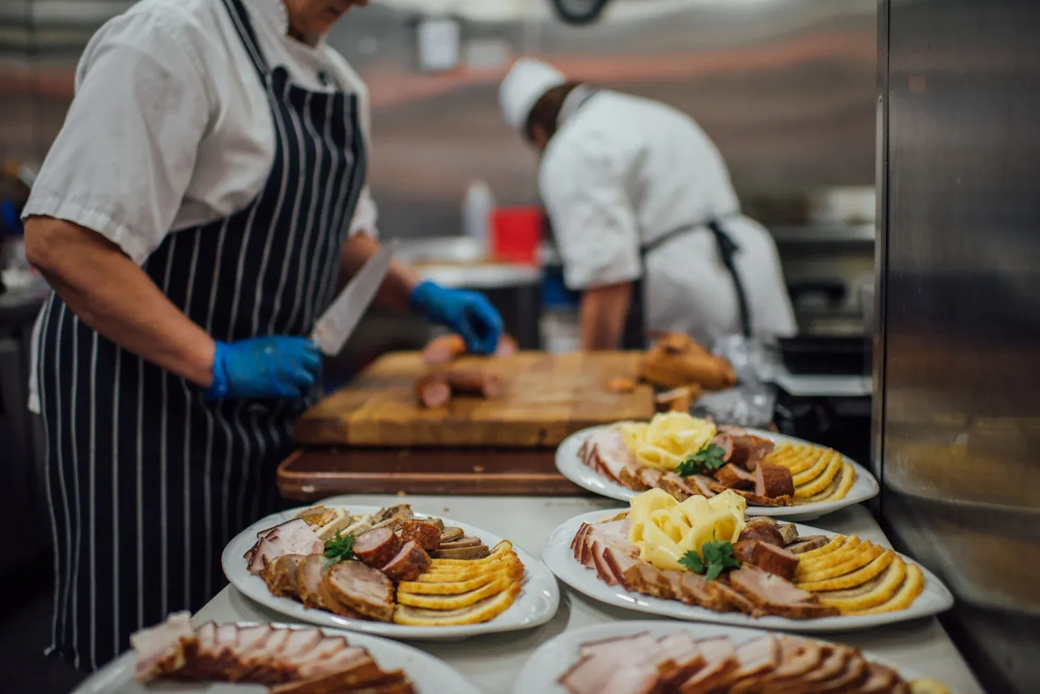 A chef plating food in the Dnister kitchen